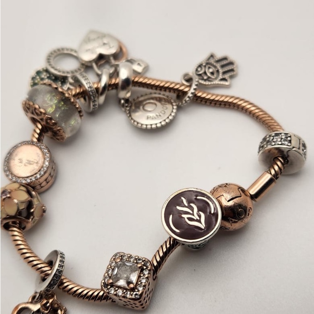 Pandora Gold and Silver Charm Bracelet with Intricate Designs